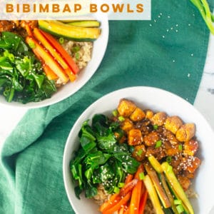 Vegan Bibimbap Bowl with tofu is the PERFECT meal! Tofu smothered in a spicy Korean sauce paired with brown rice, veggies, and kimchi. #vegandinner #veganlunch #healthy #cleaneating #asianfood #vegetarian #bibimbap | Mindful Avocado