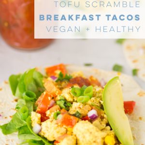 Learn how to make a Southwestern style tofu scramble. Wrap in a tortilla and pile high with avocado, salsa, and cilantro for some killer tacos! #vegan #vegetarian #glutenfree #tacos #healthy #cleaneating #veganbreakfast #tofuscramble | mindfulavocado