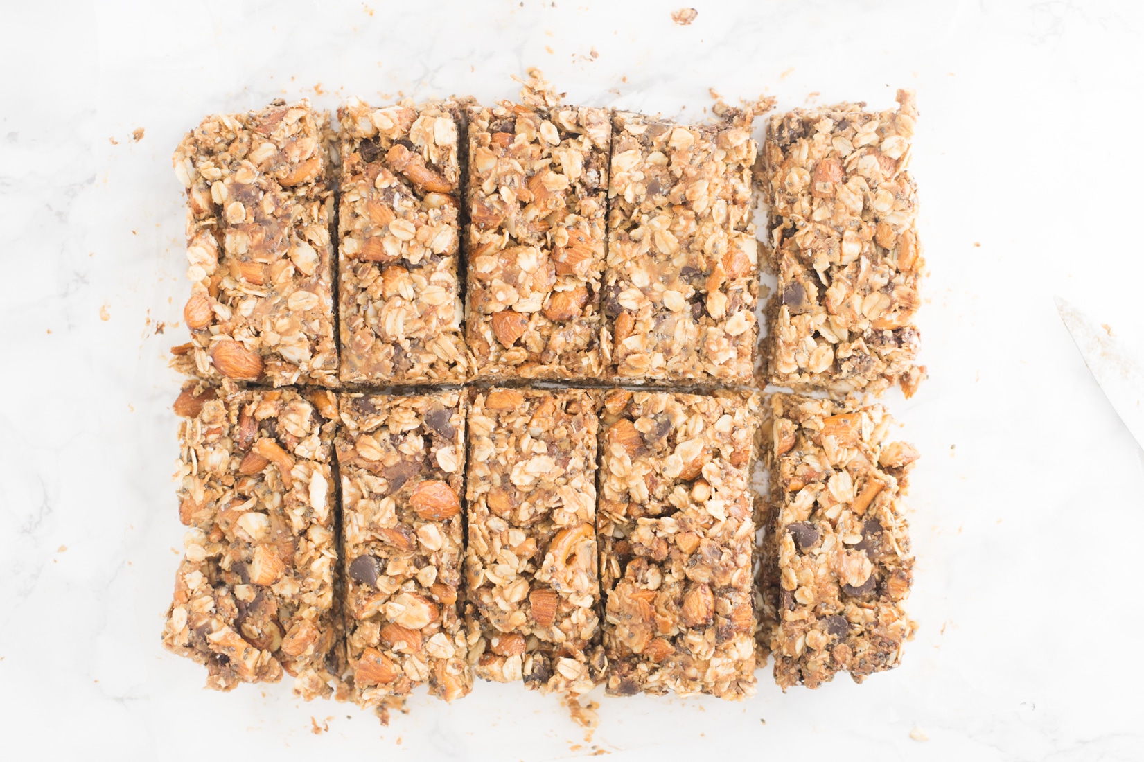 Chocolate Peanut Butter Pretzel Granola Bars -- This granola bar recipe is naturally vegan and gluten free and is packed with healthy ingredients. This takes snacking to a whole new level! - mindfulavocado