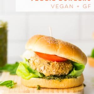 Vegan white bean burgers featuring quinoa, roasted red peppers, sun dried tomatoes, and capers. Plus, a vegan homemade pesto to die for! Perfect for a plant based weeknight meal! #vegan #glutenfree #veggieburger #plantbased | Mindful Avocado