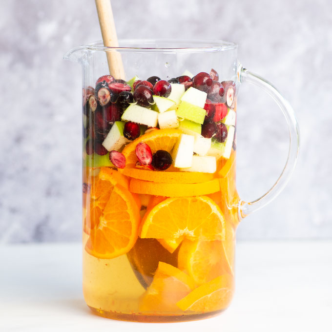 pitcher of fruit with white wine and cider