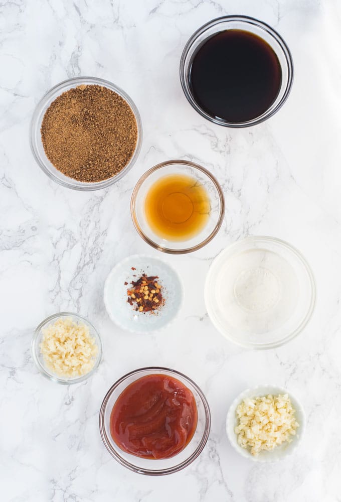 ingredients for huli huli sauce on marble background