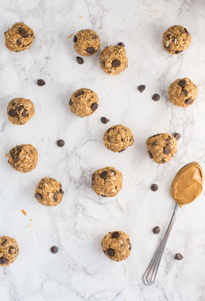 vegan peanut butter chocolate chip energy bites on marble background
