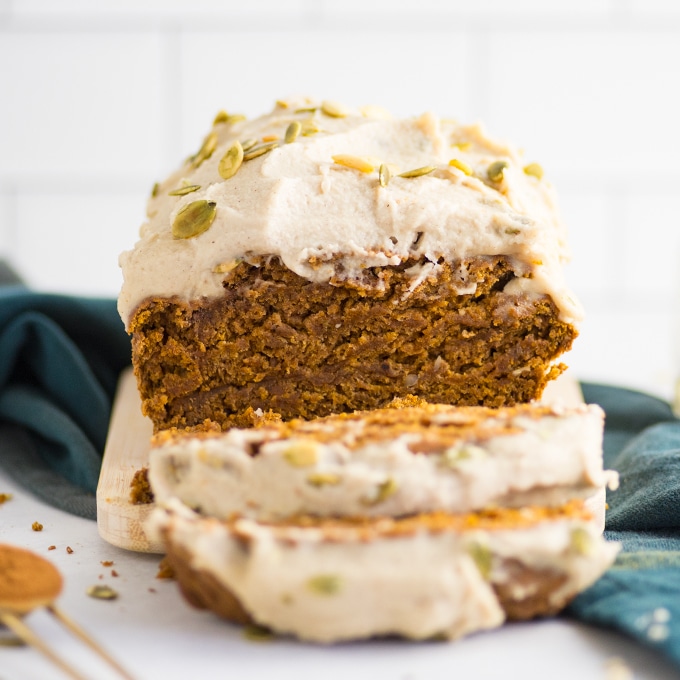 slices of vegan pumpkin bread with frosting