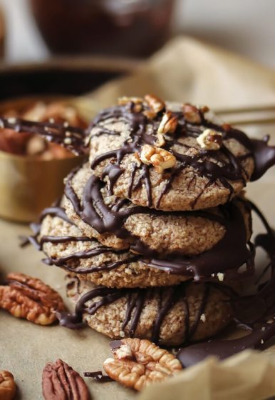A stack of Pecan Softies cookies drizzled with chocolate