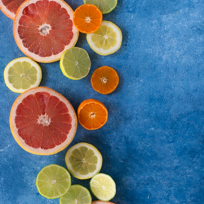 citrus fruits on blue background