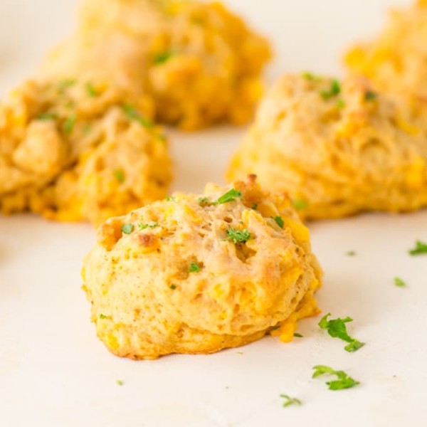 vegan cheddar bay biscuits topped with parsley