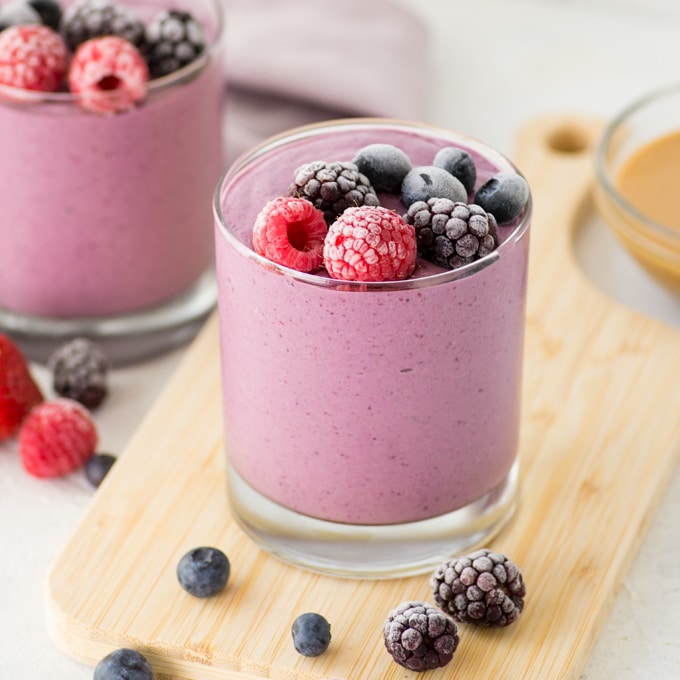 healthy vegan peanut butter and jelly smoothie with frozen berries 