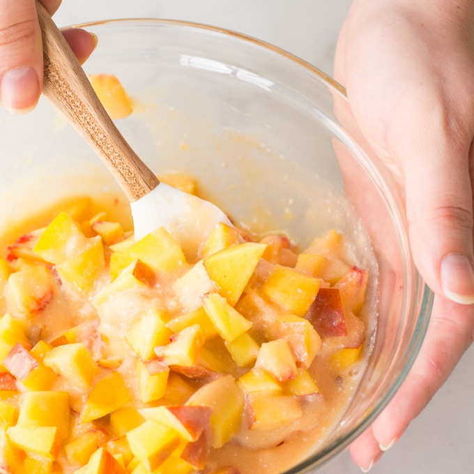 mixing peach popsicles in mixing bowl