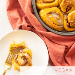 Pumpkin spice cinnamon rolls are so easy to make and vegan! Soft a pillowy rolls filled with a cinnamon sugar filling, topped with icing. #cinnamonrolls #pumpkinspice #vegancinnamonrolls #Fall #veganbaking | Mindful Avocado