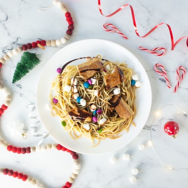 buddy the elf spaghetti on white background with christmas decorations