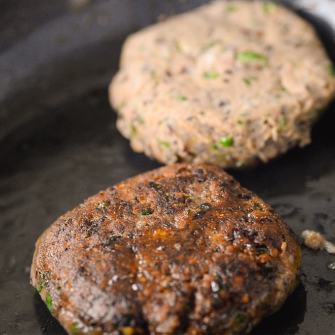 veggie burger cooking in a pan