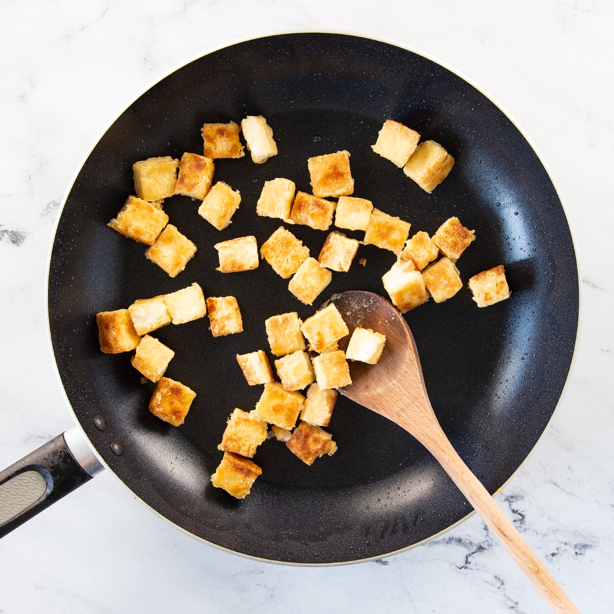 crispy tofu in large nonstick pan