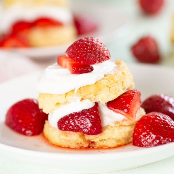 closeup of vegan strawberry shortcake with fresh strawberries on top