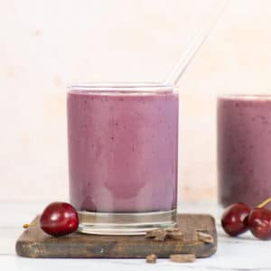 cherry smoothie with pink background