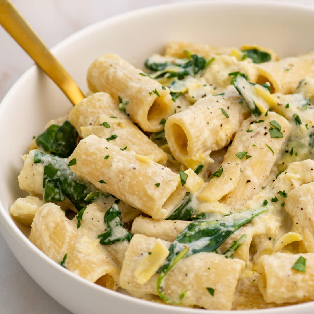 creamy vegan spinach artichoke pasta