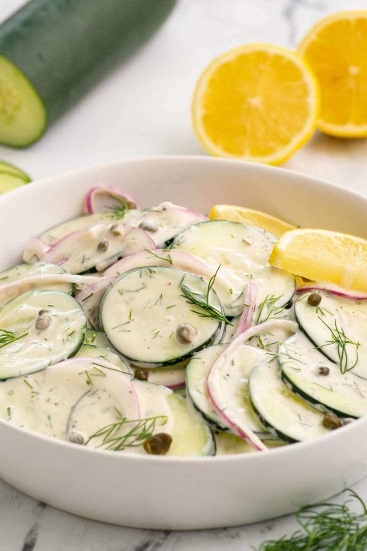 close up view of vegan cucumber salad in a serving bowl